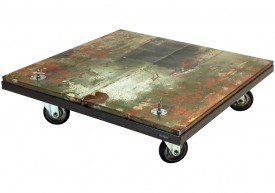 Three quarter view of an industrial table made with the hood of a Ford Comet 1966 car.