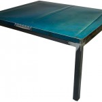 Three quarter view of an industrial table made with the hood of a Ford Galaxie 500 1968 car.