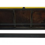 Underside view of a table made with the trunk of an unknown yellow and black sport car.