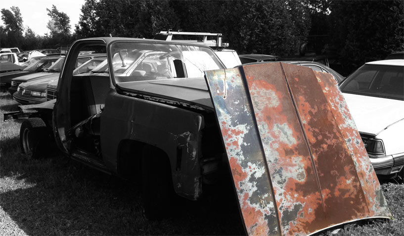 Unknown car hood available for the creation of an industrial table or artwork.