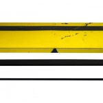 Front view of a table made with the trunk of an unknown yellow and black sport car.
