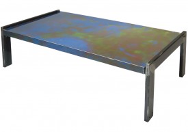 Three quarter view of an industrial table made with the trunk of a Plymouth Belvedere 1966 car.