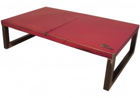 Three quarter view of an industrial table made with the trunk of a 1963 Plymouth Fury car.