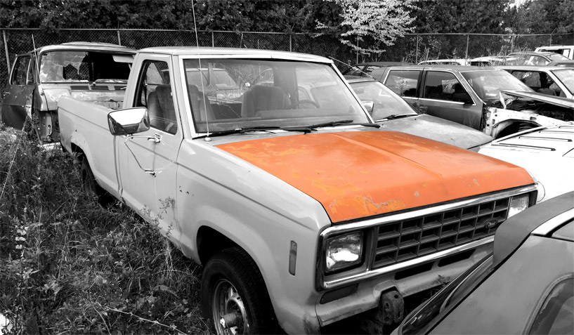 1982 Ford Ranger truck on which the hood was taken and is available for the creation of an industrial table or artwork.