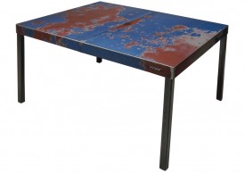 Three quarter view of a table made with the hood of an unknown blue and red car by Oxyd Factory.